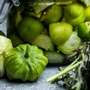 bright green tomatillos that look like green tomatoes with a papery lid