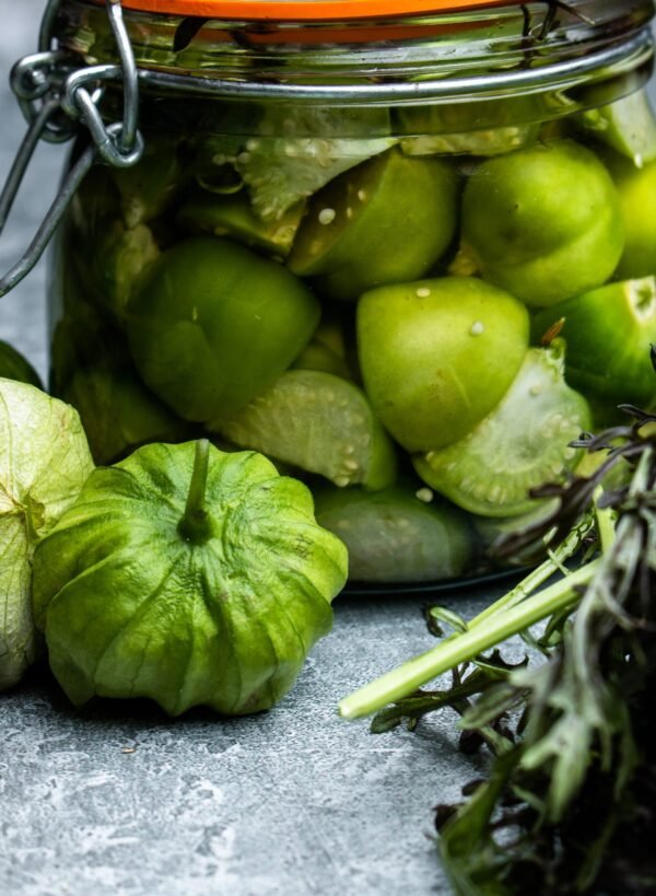 bright green tomatillos that look like green tomatoes with a papery lid